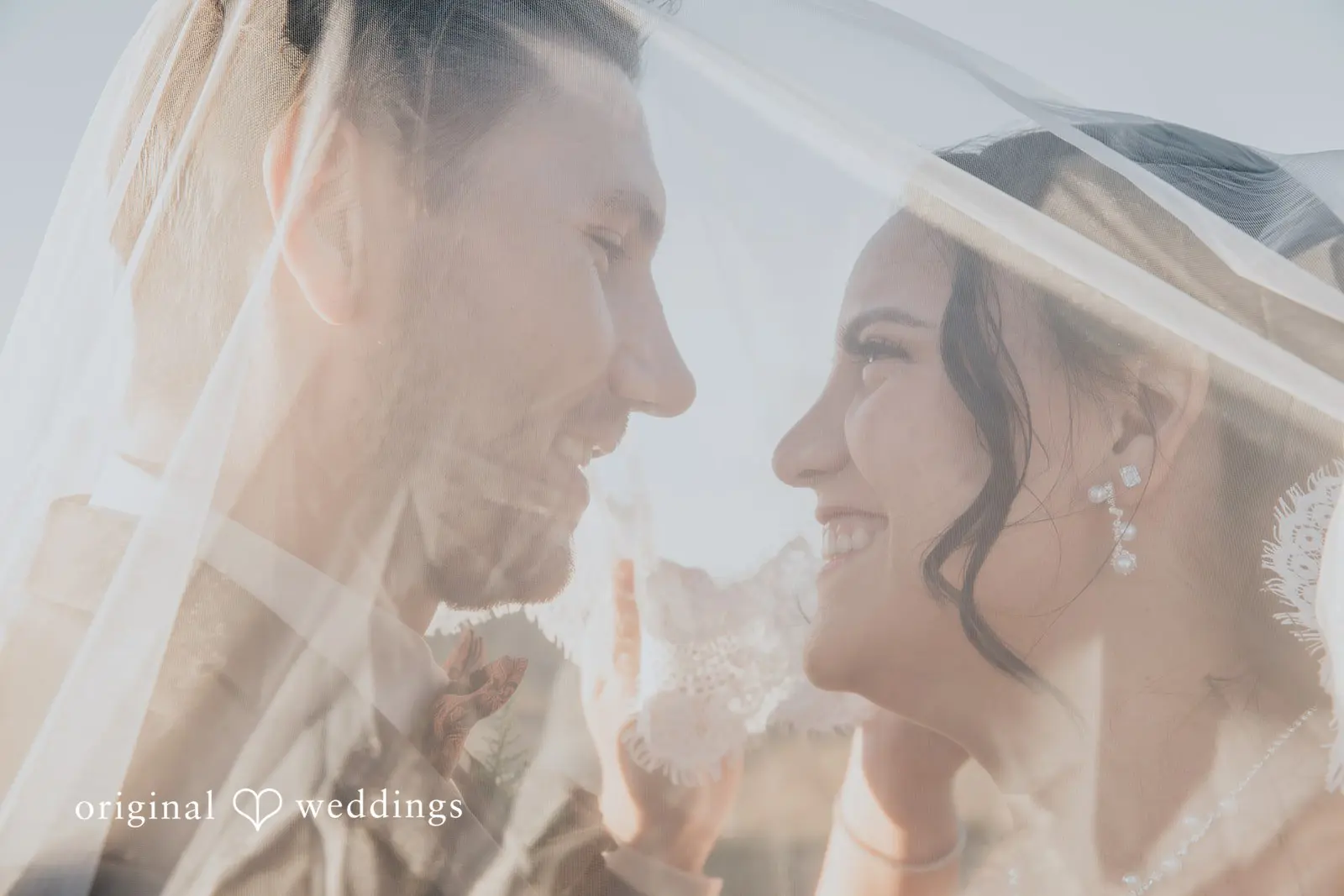 A romantic headshot of the bride and groom
