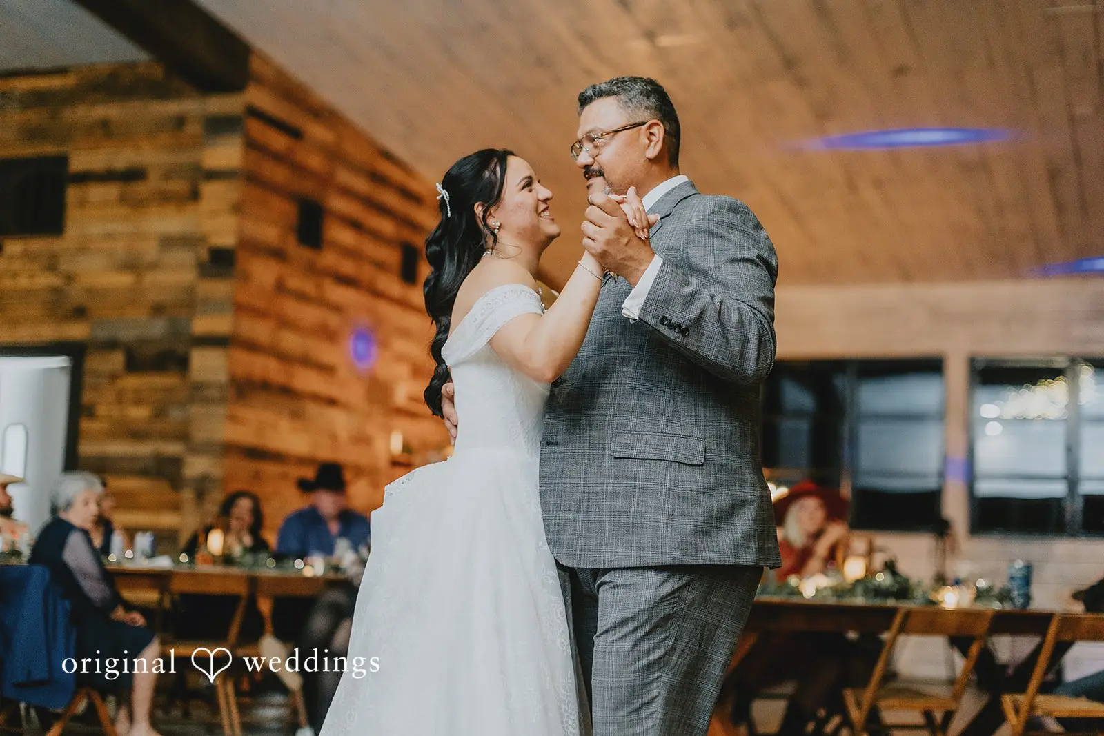 The bride dances with her father at her reception