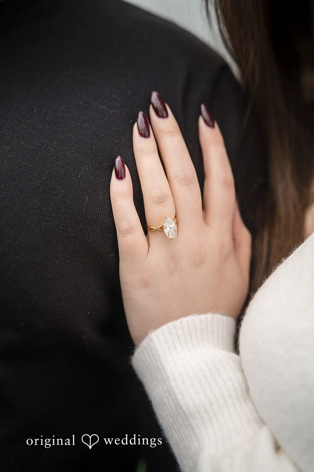A close-up shot of Madison's engagement ring on her finger