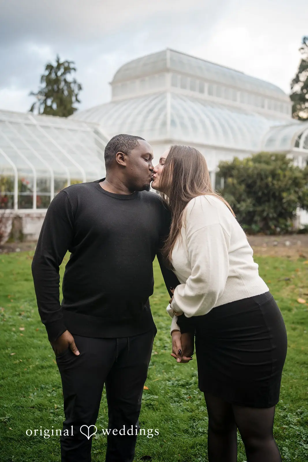 The couple shares a kiss