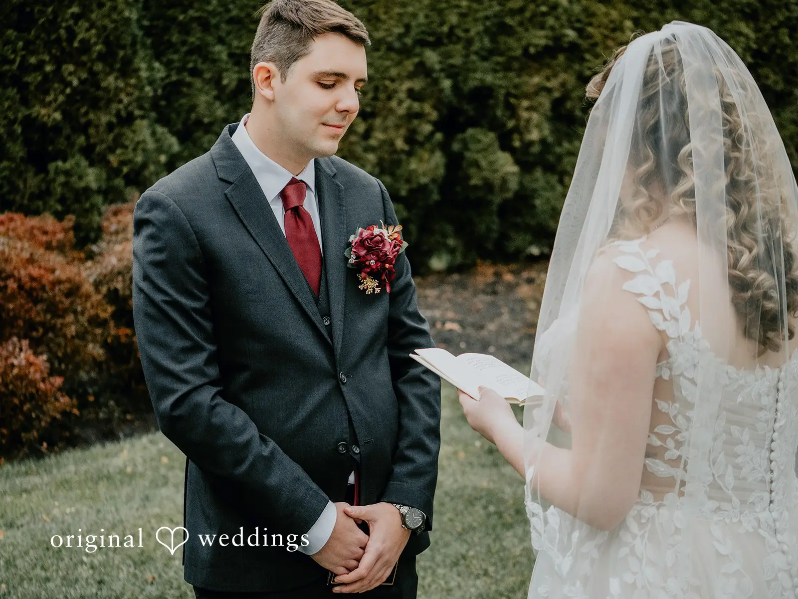 The bride reads her vows to the groom