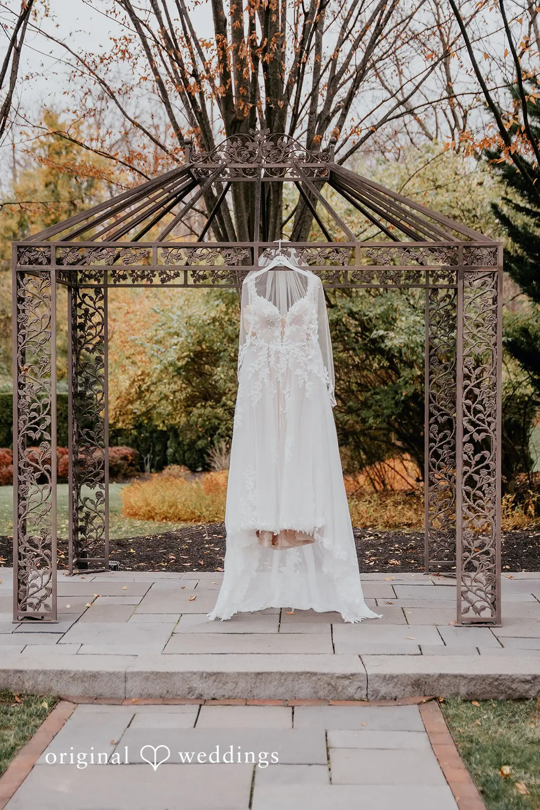 The bride's gown gracefully hanging in the outdoor area at William Penn Inn