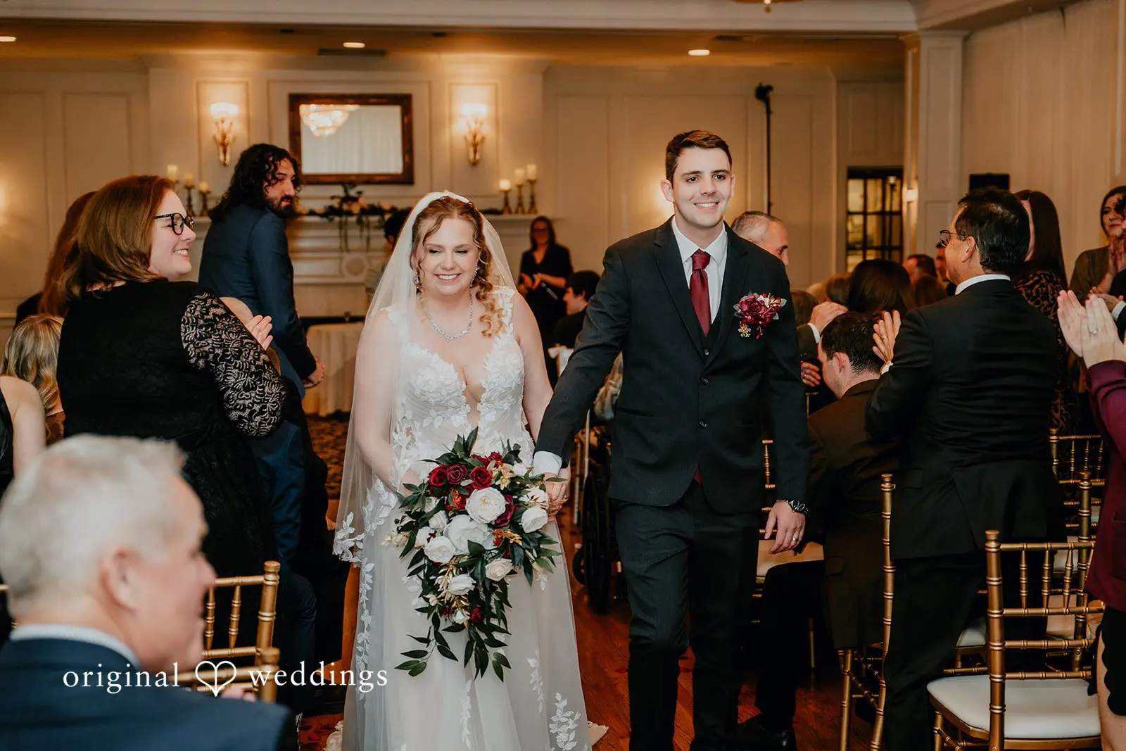 The bride and groom exiting the wedding ceremony room