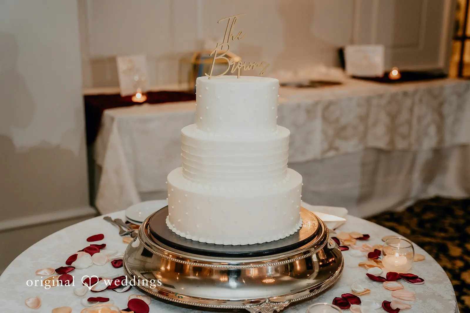 An all-white cake at the wedding reception