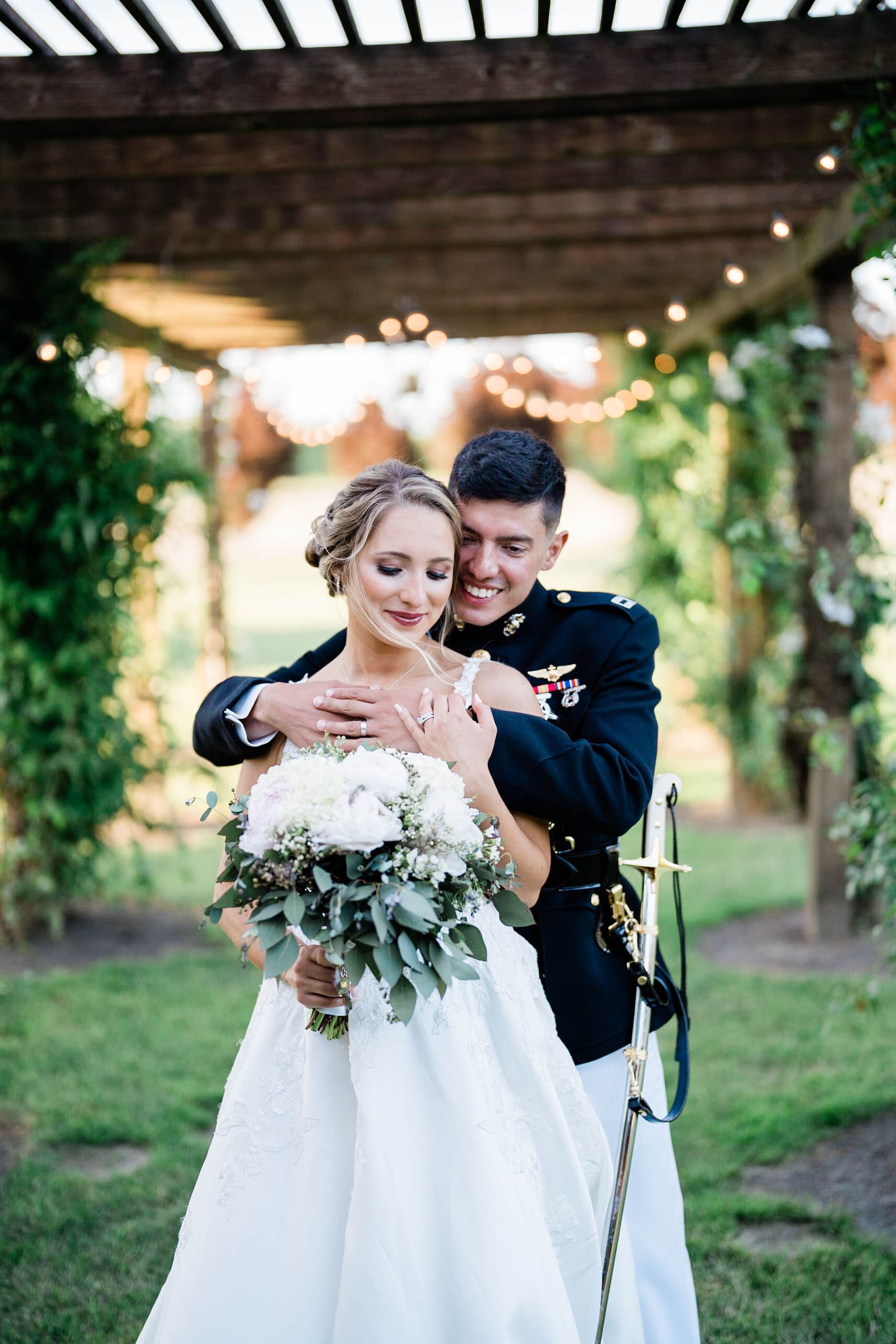 bride and groom pose outside craven farm wedding venue for gorgeous photos