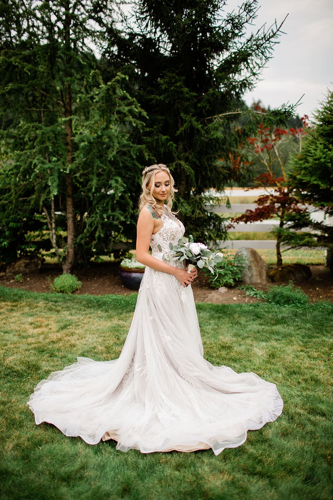 Bride adores her flowers at the rein fire ranch