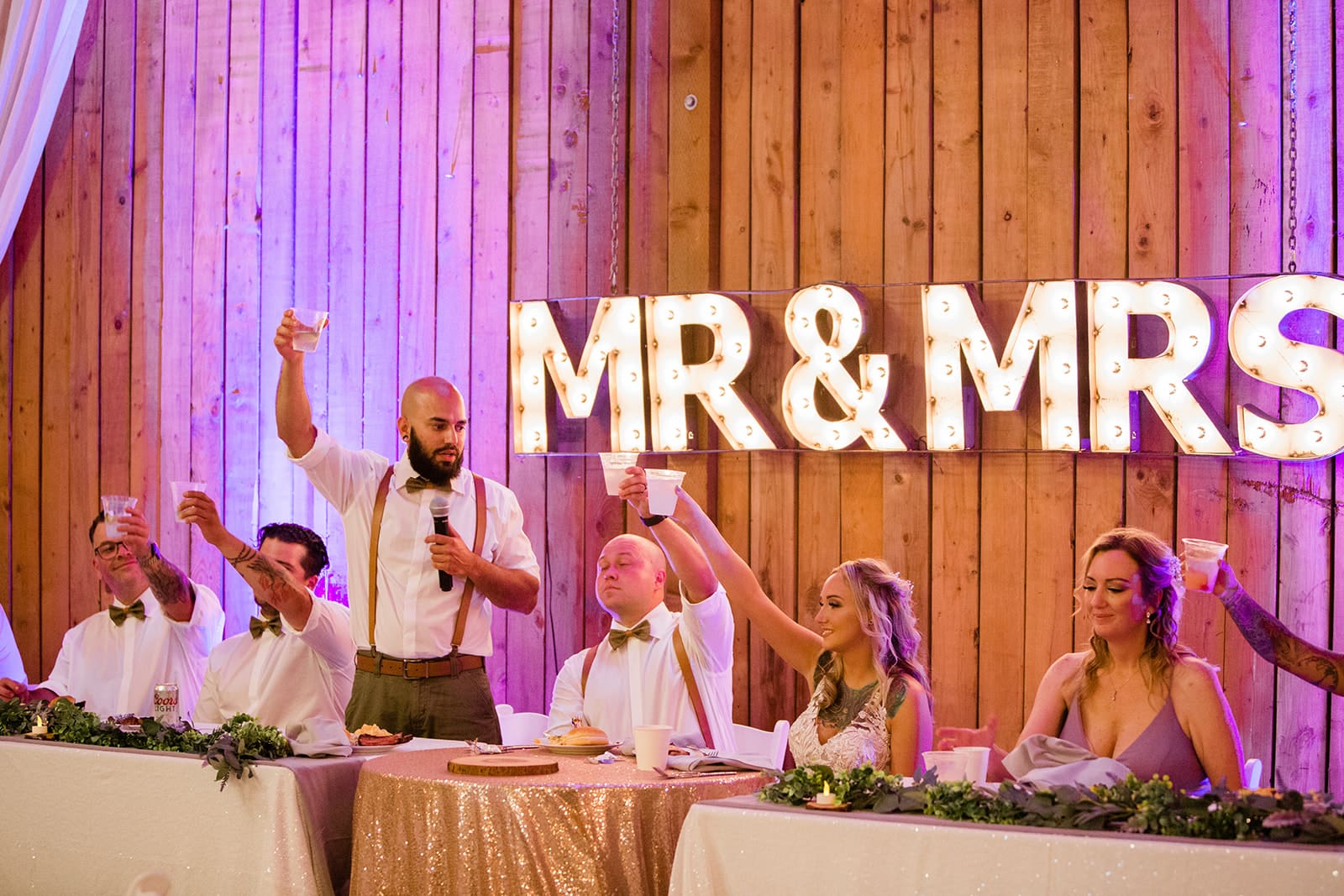 Grooms' friend say words for couple on their wedding