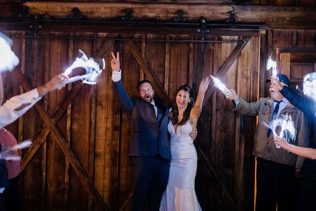 Couple exiting the Wedding venue at a Cattle Barn Wedding