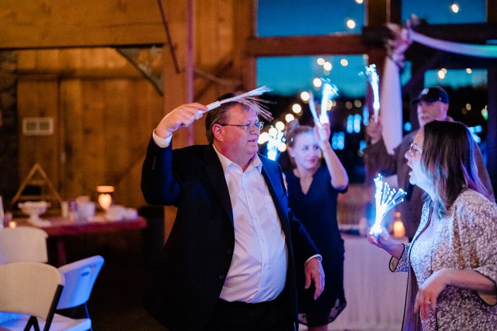 Guest dancing at a Cattle Barn Wedding