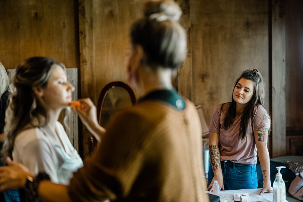 Bride getting ready at a Cattle Barn Wedding