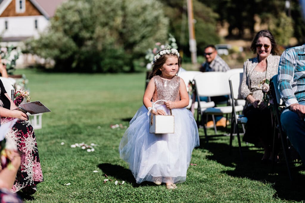 Cute flower girl at a Cattle Barn Wedding