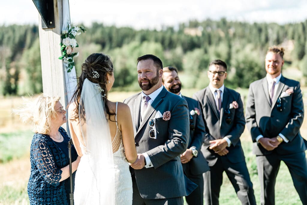 Bride and Groom at the altar of a Cattle Barn Wedding
