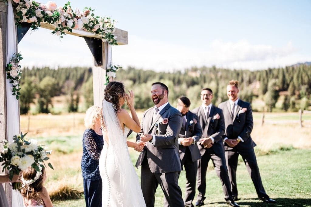 Bride and Groom at the altar of a Cattle Barn Wedding