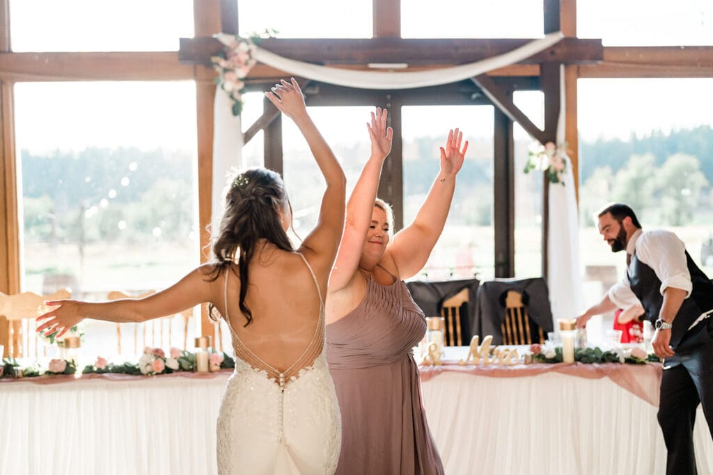 Bride dancing at a Cattle Barn Wedding