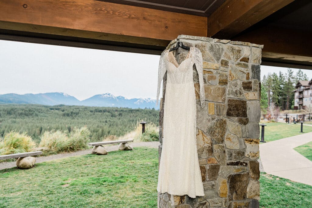 Bride's dress hangs beautifully outside Swiftwater Cellars