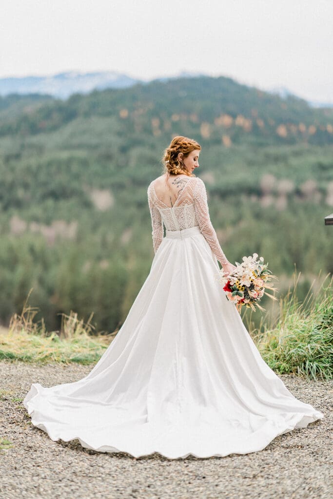 Bride tentative look with flowers outside at Swiftwater Cellars