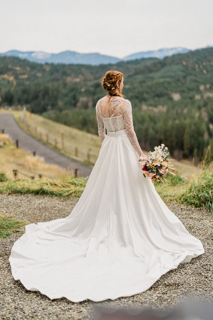 Bride gazes outside at Swiftwater Cellars