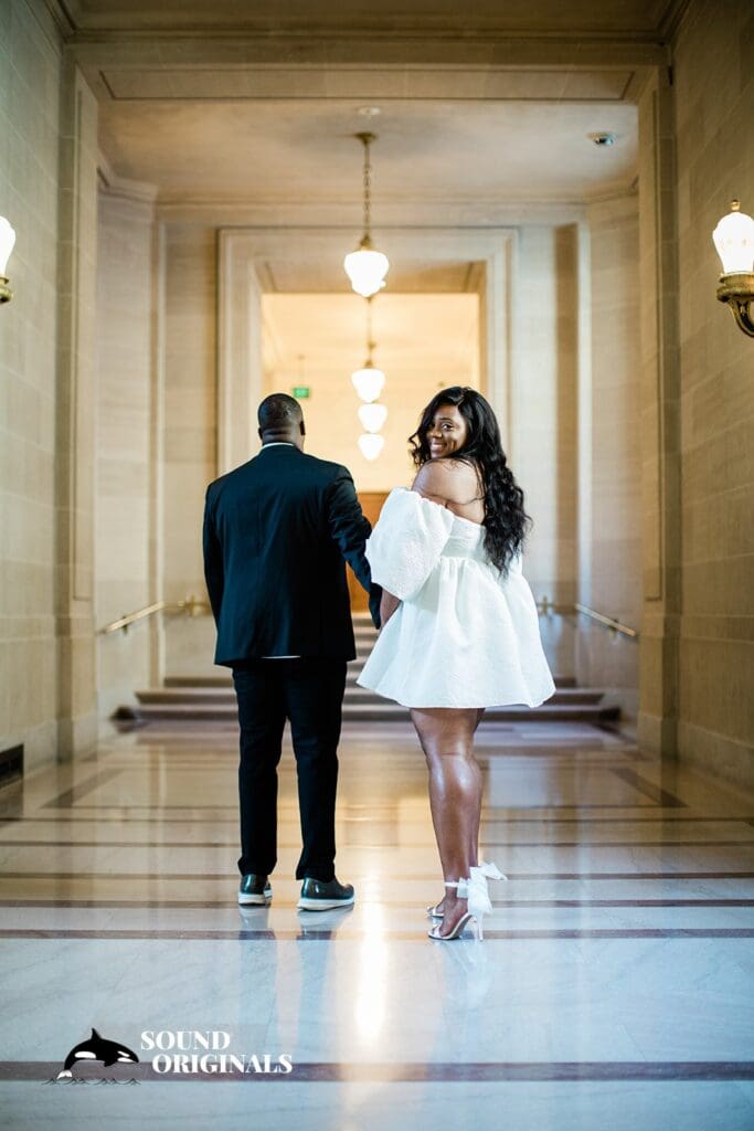 Engagement photo at San Francisco City Hall, one of the 24 Best Places for Engagement Photos in San Francisco, captured by our San Francisco wedding photography & videography team.