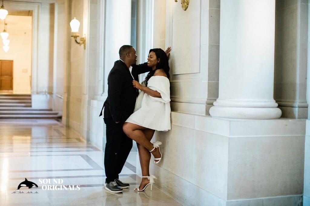 Engagement photo at San Francisco City Hall, one of the 24 Best Places for Engagement Photos in San Francisco, captured by our San Francisco wedding photography & videography team.