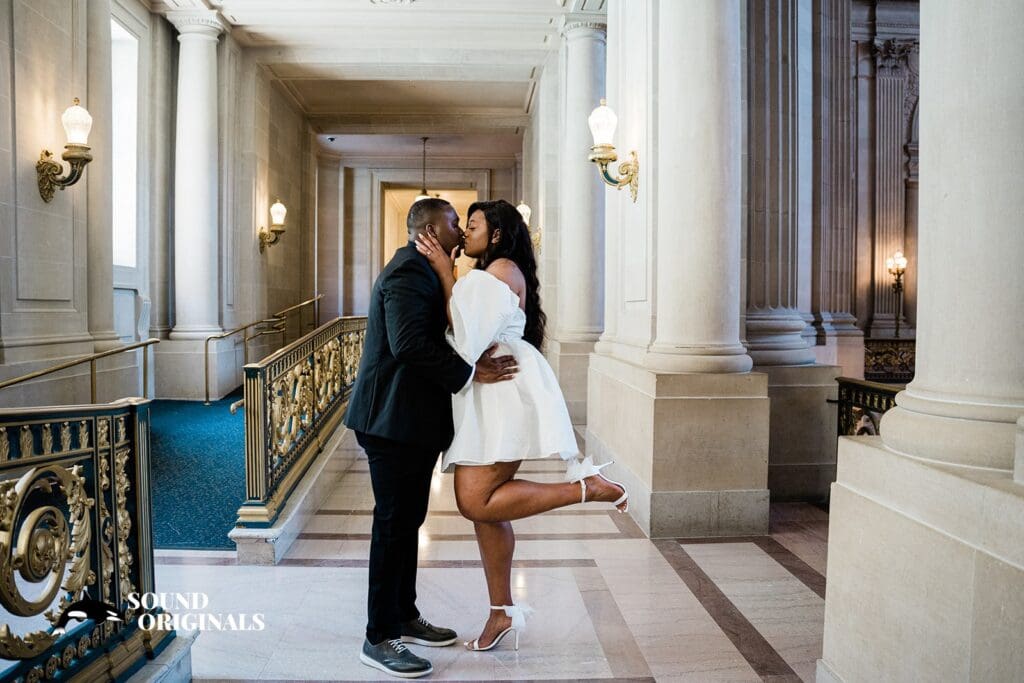 Engagement photo at San Francisco City Hall, one of the 24 Best Places for Engagement Photos in San Francisco, captured by our San Francisco wedding photography & videography team.