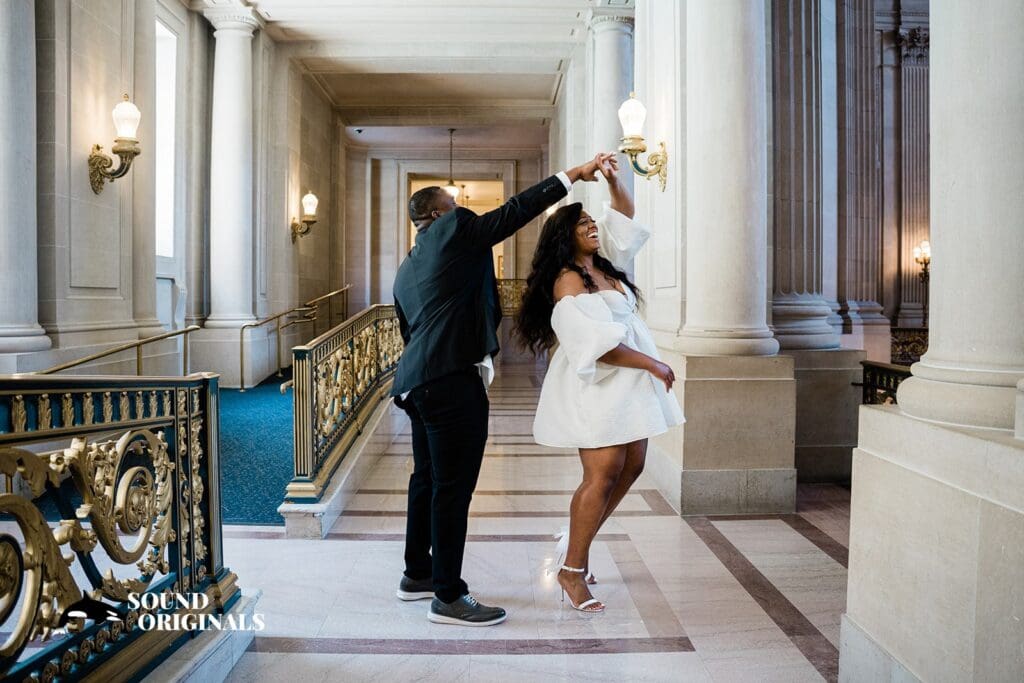 Engagement photo at San Francisco City Hall, one of the 24 Best Places for Engagement Photos in San Francisco, captured by our San Francisco wedding photography & videography team.