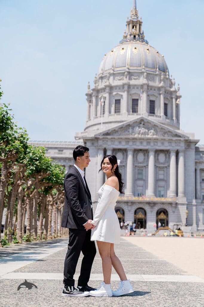 Engagement photo at San Francisco City Hall, one of the 24 Best Places for Engagement Photos in San Francisco, captured by our San Francisco wedding photography & videography team.