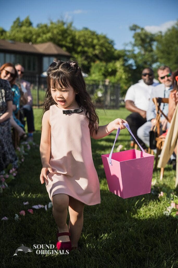 Photographer captures beautiful pinky flower girl in the Private Home Wedding