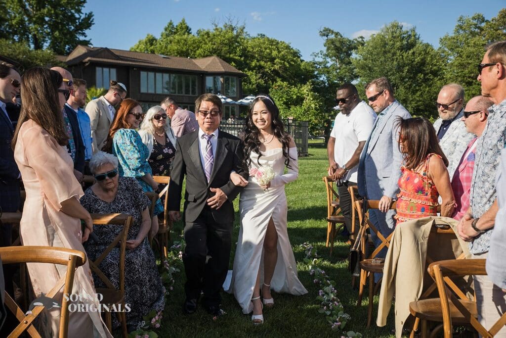 Bride's father ushers her in for a Private Home Wedding