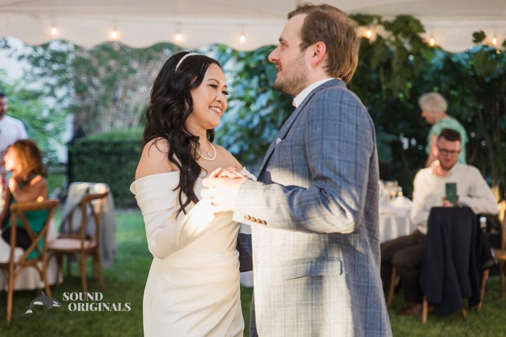 Bride and groom in a romantic moment at the Private Home Wedding reception