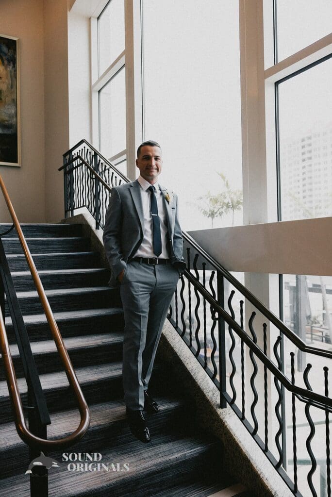 Nicole + Ryan Elegant groom descending the stairs of Plant Park, Jackson's, Yeomans
