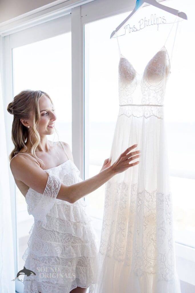 The bride looking at her wedding dress for The Palms Hotel & Spa Wedding