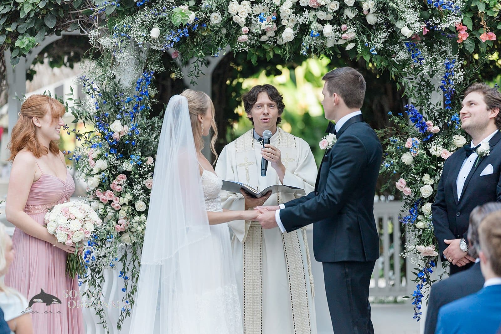 The bride and groom at the altar of their The Palms Hotel & Spa Wedding