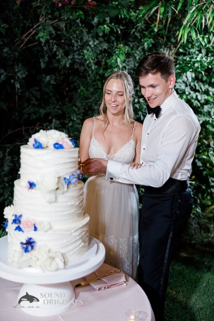 The happy couple cut the cake at The Palms Hotel & Spa Wedding