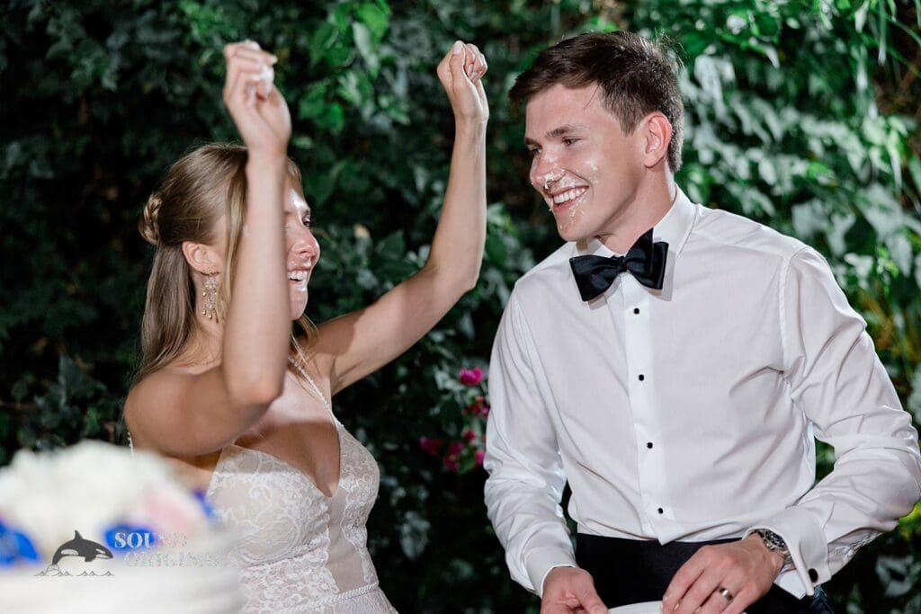 Messy groom after cutting the cake at The Palms Hotel & Spa Wedding