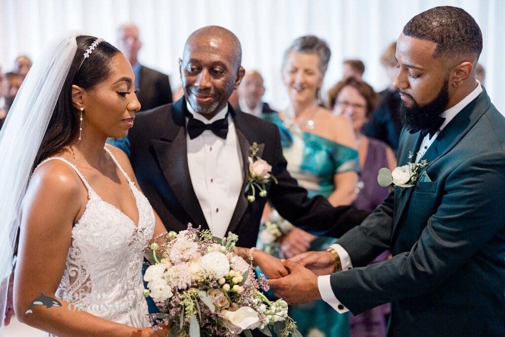 Father gives his daughter's hand to the groom at Briza on the Bay Wedding