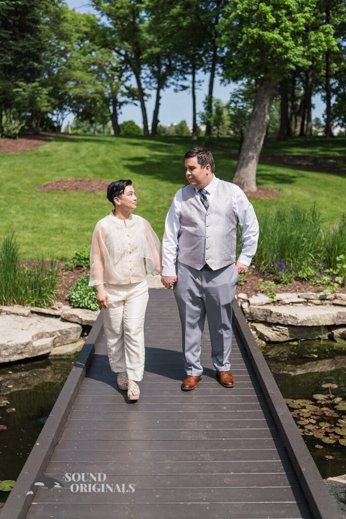 Bride and groom walking hand in hand to their Monte Bello Estate Wedding