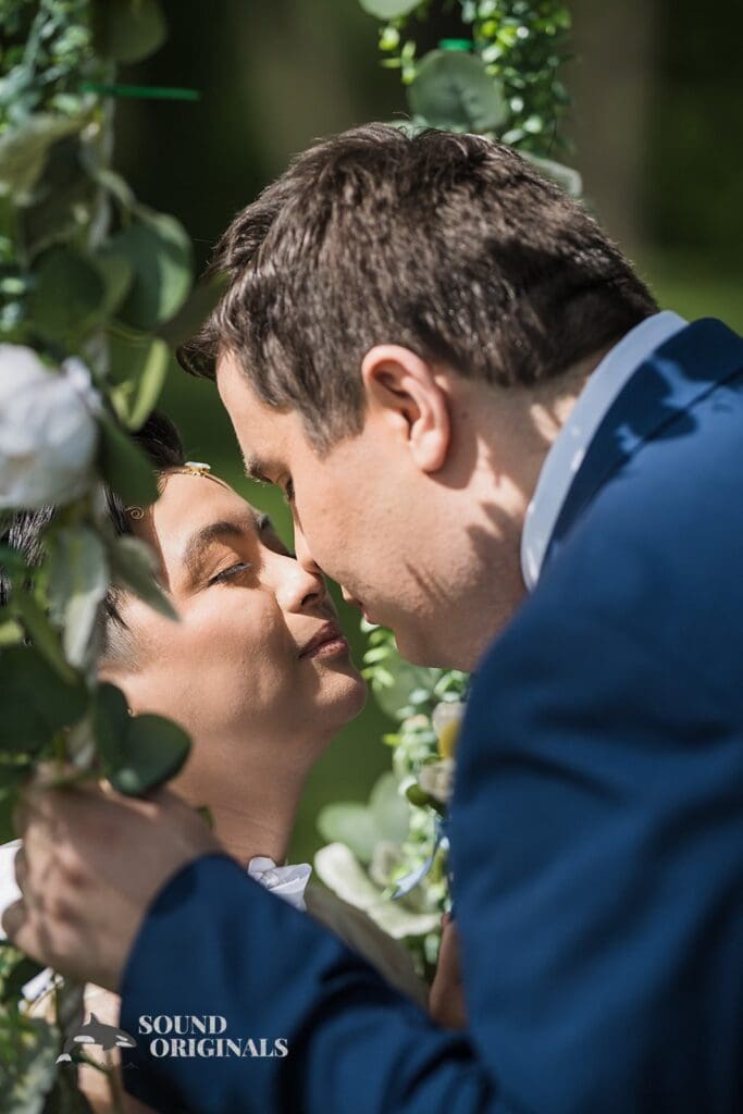 A kiss between the bride and groom at Monte Bello Estate Wedding