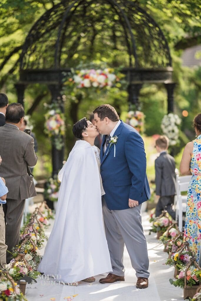 Kiss shared between bride and groom at Monte Bello Estate Wedding