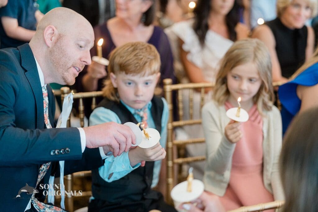 Royal Melbourne Country Club Wedding Lighting candles at the Royal Melbourne Country Club Wedding