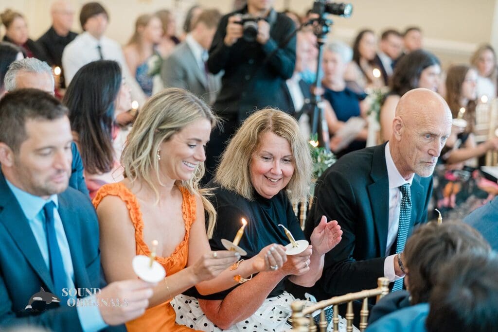 Royal Melbourne Country Club Wedding Guests lighting candles at the Royal Melbourne Country Club Wedding
