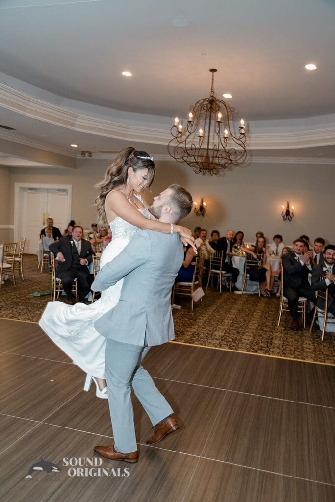 Royal Melbourne Country Club Wedding The groom spinning the bride round during their first dance at the Royal Melbourne Country Club Wedding reception