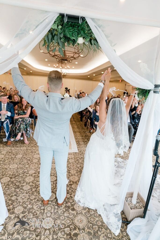 Royal Melbourne Country Club Wedding The bride and groom celebrate getting married at the Royal Melbourne Country Club Wedding