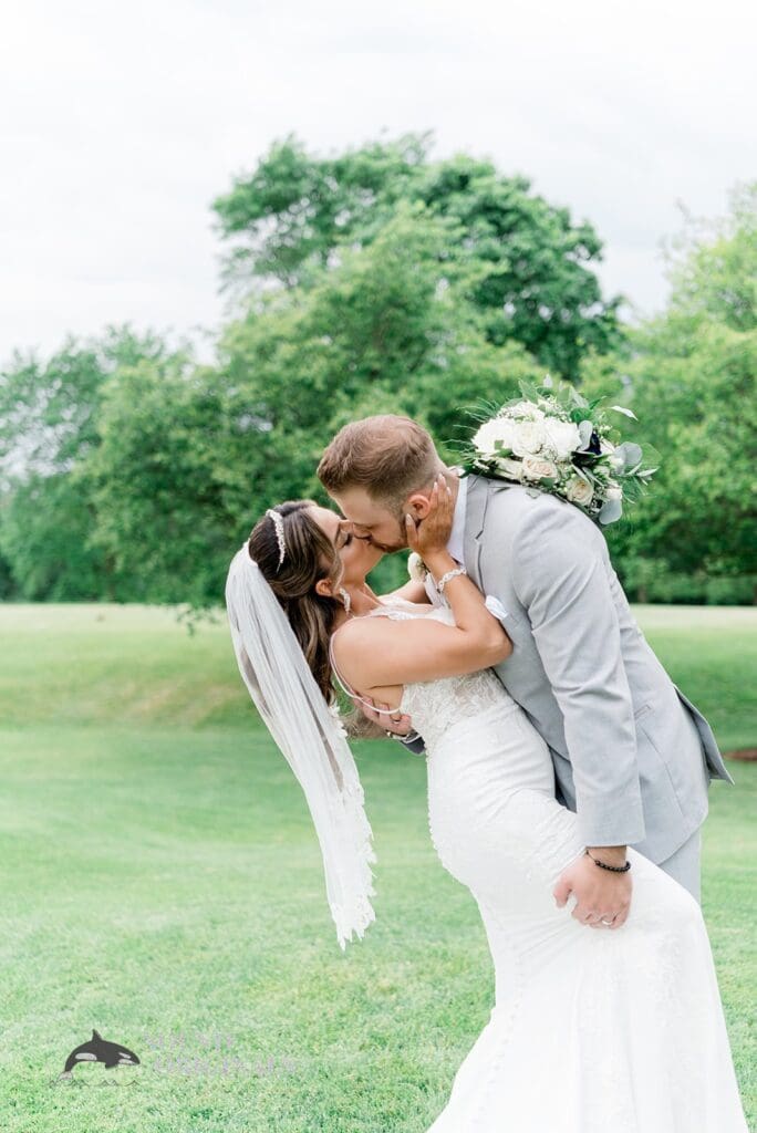 Royal Melbourne Country Club Wedding Kiss between newlyweds in the grounds of Royal Melbourne Country Club Wedding