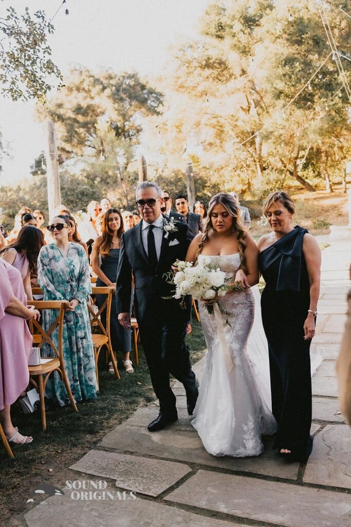 Bride's mum and dad lead bride to The Havens Country Club Wedding altar