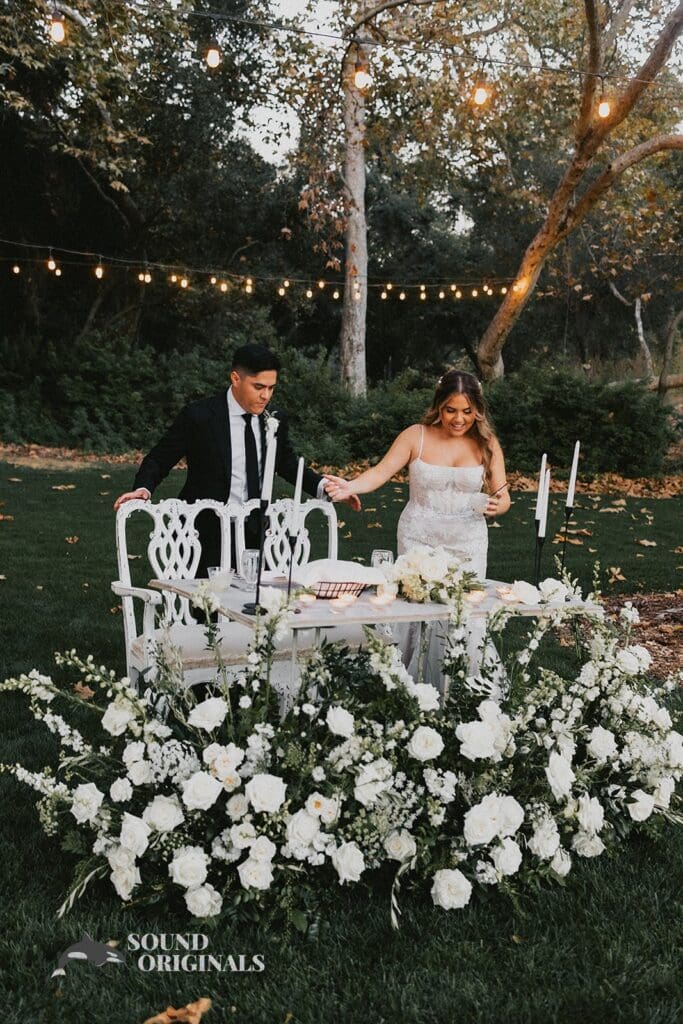 Bride and groom about to sit on the beautiful couple's seat at The Havens Country Club Wedding