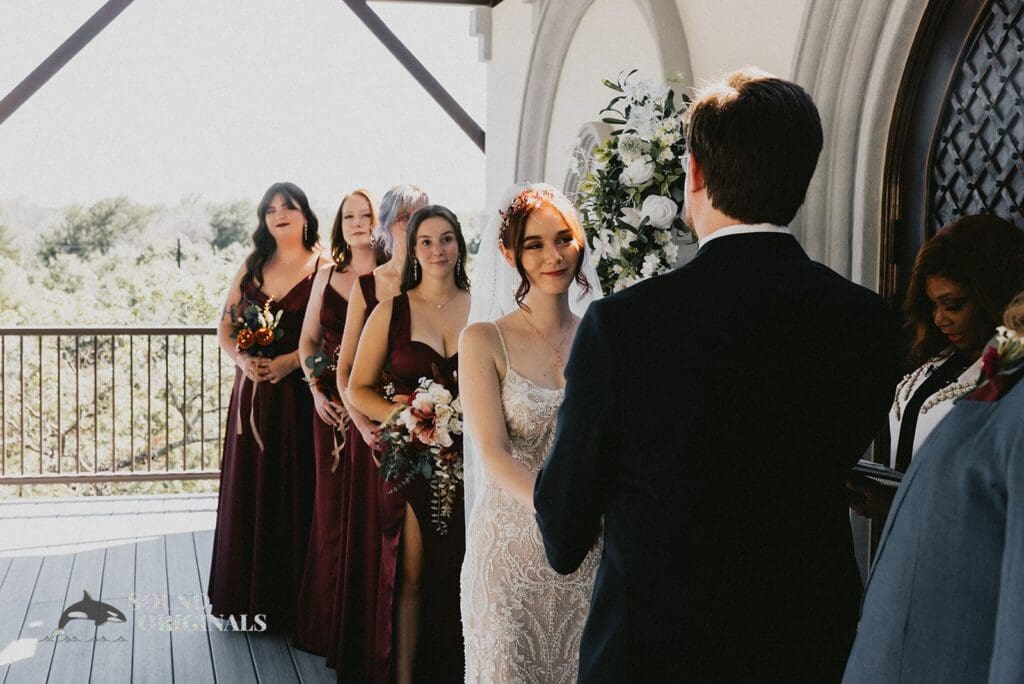The bride and her bridesmaids at the altar of Stoney Ridge Villa Wedding