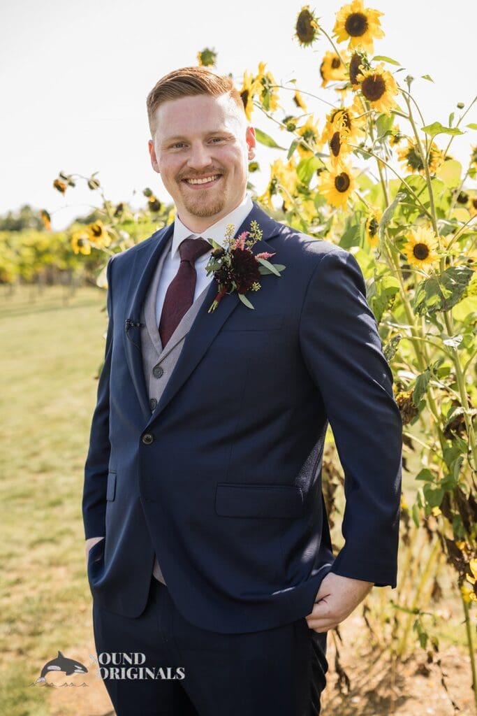 happy groom near sunflower fields at Folino Estate Winery