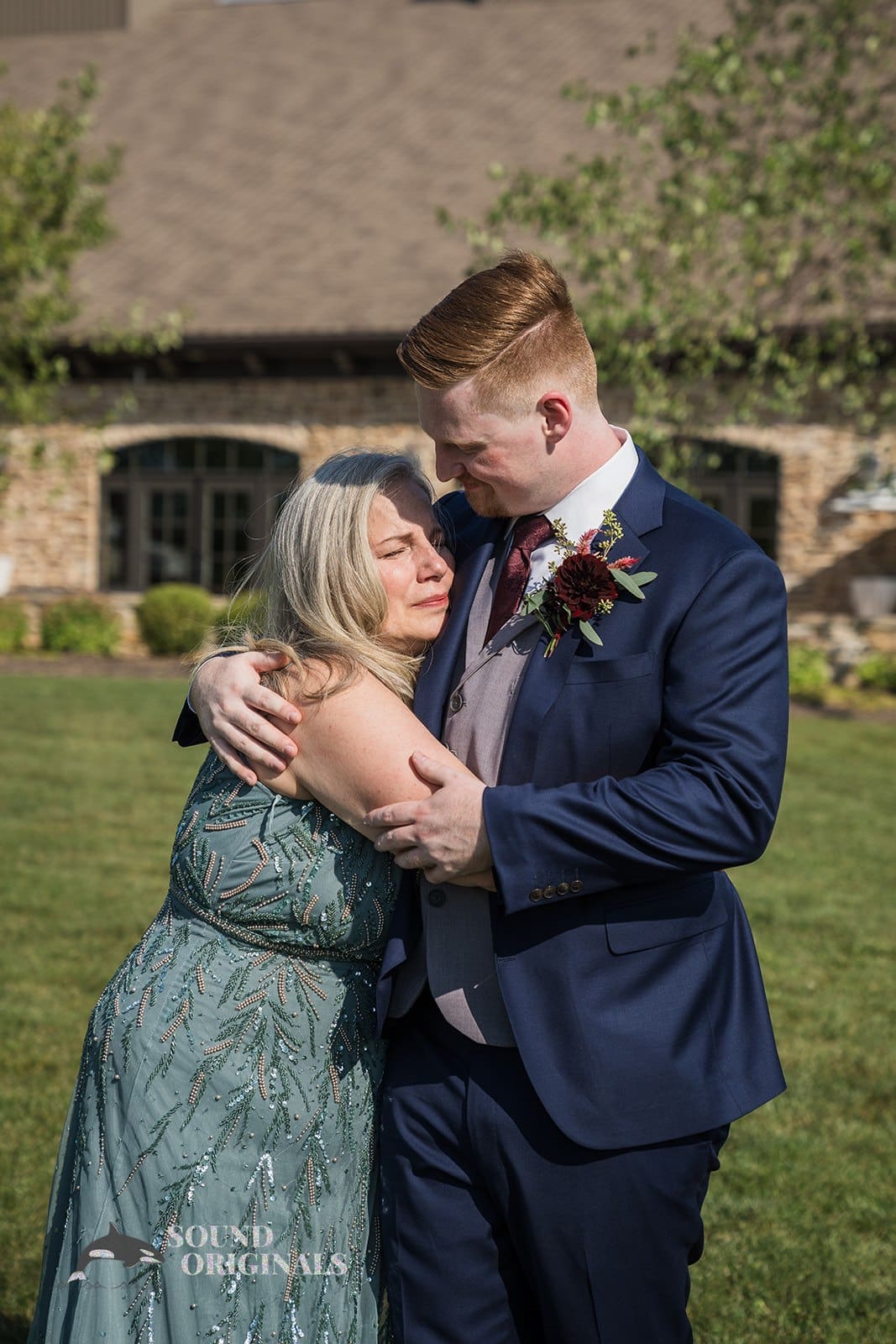 Mother of the groom hugging her son at Folino Estate Winery