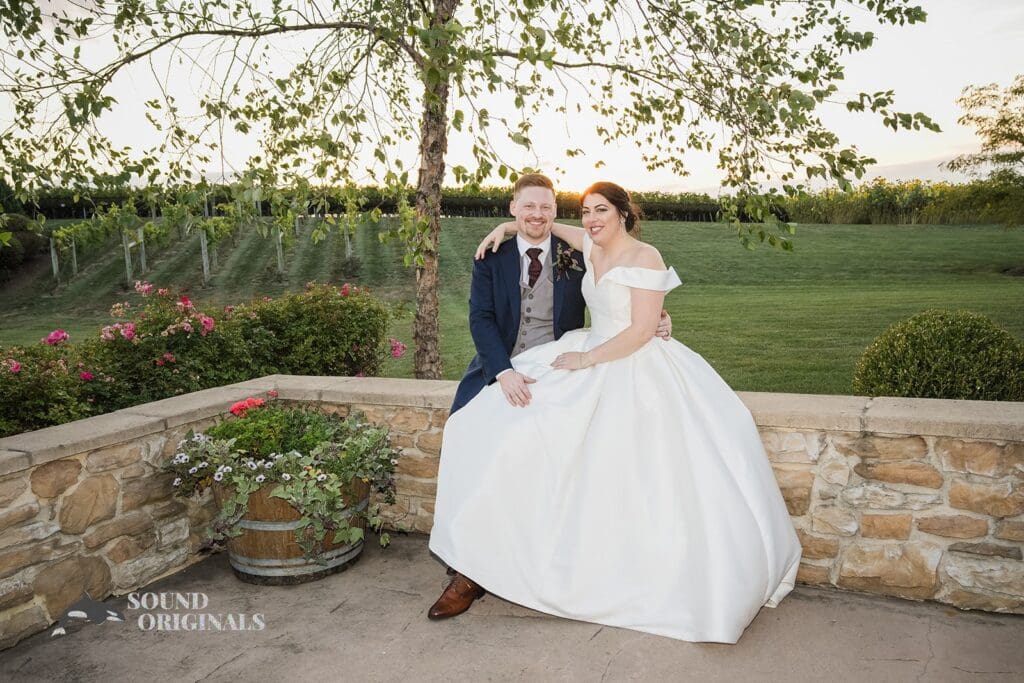 Smiling newlyweds at the patio of Folino Estate Winery