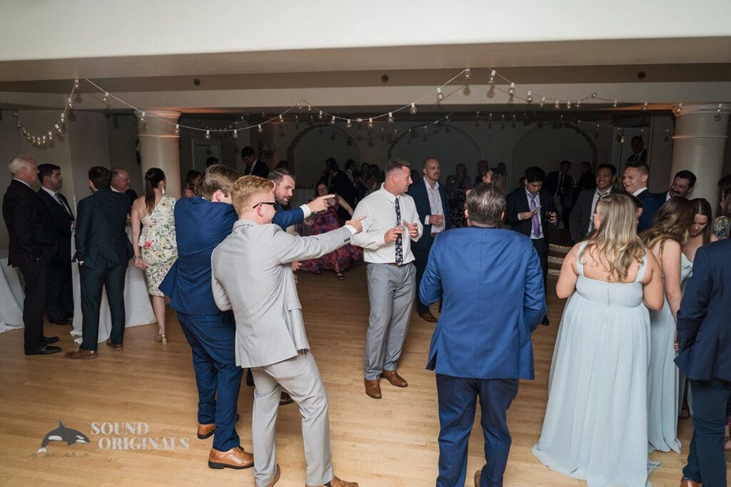 Guests enjoy the dancefloor after Cathedral Basilica of the Immaculate Conception Wedding